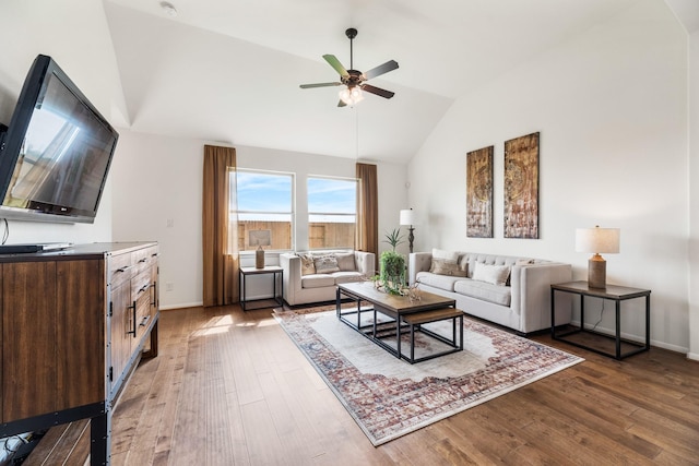 2608 Bisbee Rd, League City, TX 77573 - living area featuring lofted ceiling, a ceiling fan, wood-type flooring, and baseboards
