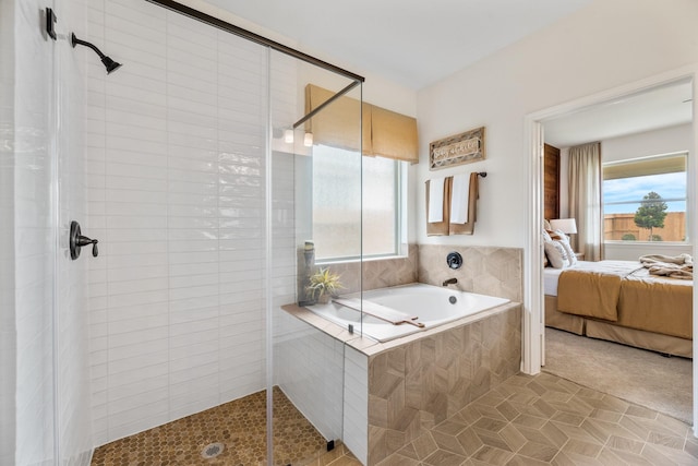 2608 Bisbee Rd, League City, TX 77573 - ensuite bathroom with healthy amount of natural light, a stall shower, and tile patterned flooring
