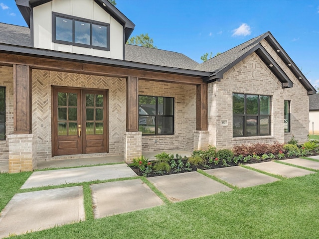 852 Rd 6609, Dayton, TX 77535 - property entrance with brick siding, roof with shingles, and covered porch