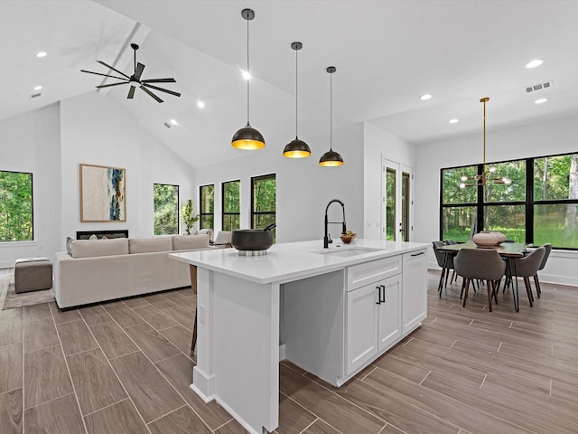 852 Rd 6609, Dayton, TX 77535 - kitchen featuring open floor plan, plenty of natural light, light countertops, recessed lighting, and high vaulted ceiling