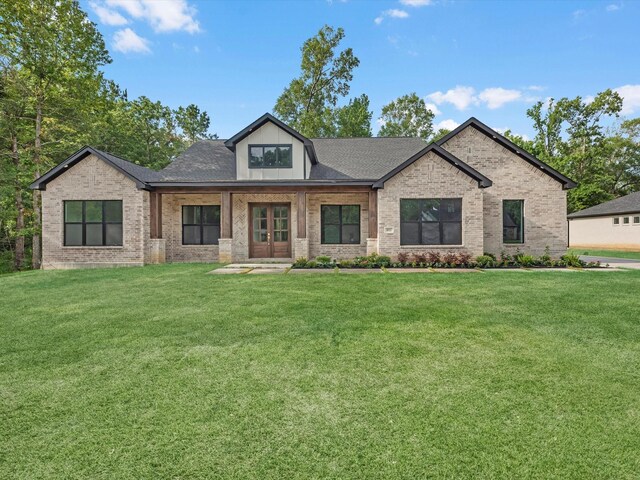 852 Rd 6609, Dayton, TX 77535 - view of front of home featuring a front yard and brick siding