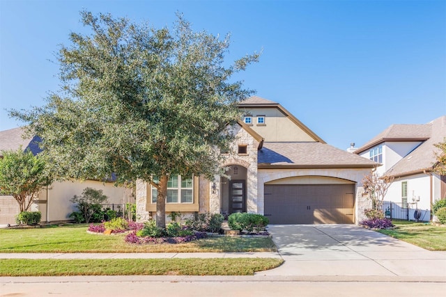 11 Floral Hills Ln, Fulshear, TX 77441 - view of front of property with an attached garage, stone siding, concrete driveway, a front lawn, and stucco siding
