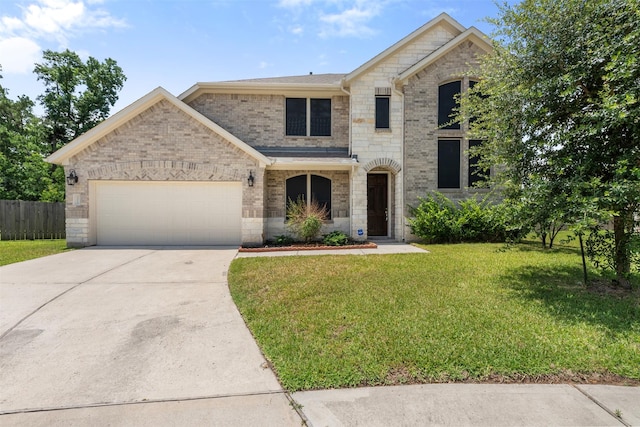 18202 Fehmarn Sound Cir, Houston, TX 77044 - french country home with an attached garage, concrete driveway, and brick siding