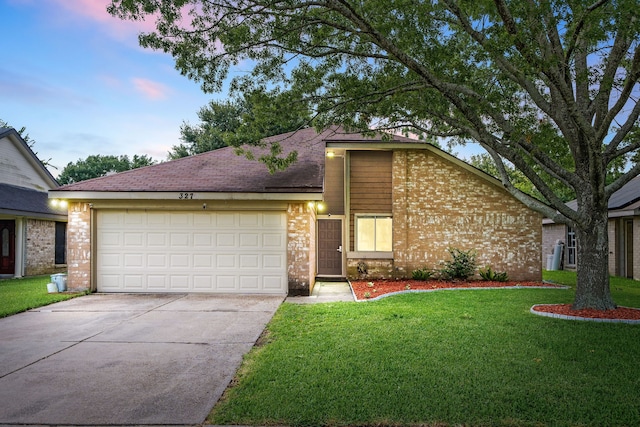 327 Brompton Ct, Highlands, TX 77562 - mid-century modern home with brick siding, concrete driveway, a garage, and a front yard