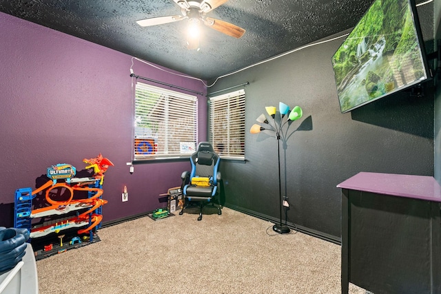327 Brompton Ct, Highlands, TX 77562 - game room featuring carpet, a textured ceiling, ceiling fan, a textured wall, and baseboards