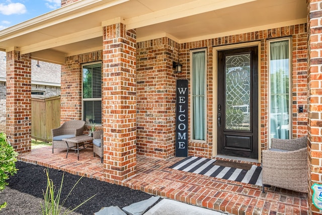 300 Bentside Pl, Clute, TX 77531 - view of exterior entry featuring brick siding and a porch
