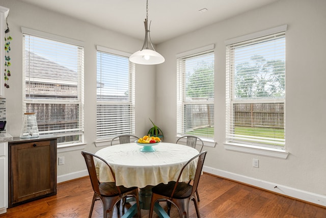 300 Bentside Pl, Clute, TX 77531 - dining area with baseboards and dark wood finished floors