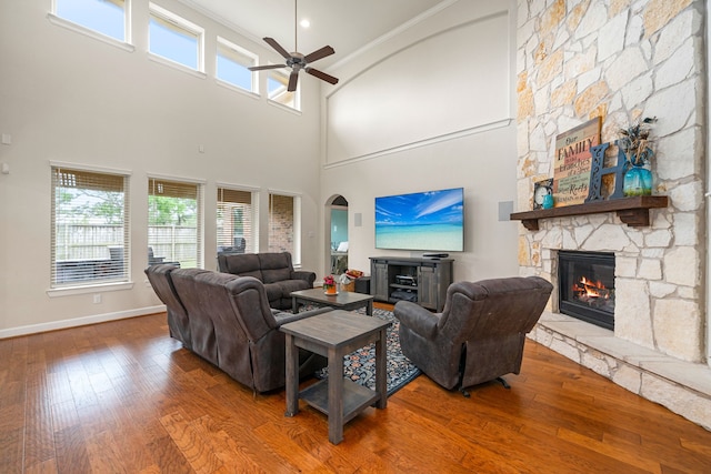 300 Bentside Pl, Clute, TX 77531 - living room with a fireplace, a ceiling fan, wood-type flooring, crown molding, and baseboards