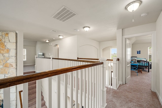 300 Bentside Pl, Clute, TX 77531 - hall with an upstairs landing, light colored carpet, and baseboards