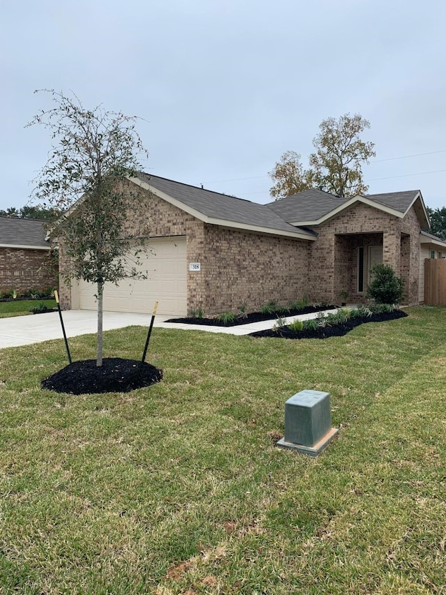 318 Riverwood Village Ln, Sealy, TX 77474 - view of front of property featuring an attached garage, concrete driveway, and brick siding
