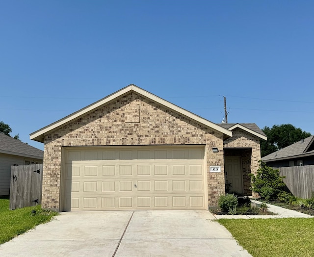 318 Riverwood Village Ln, Sealy, TX 77474 - ranch-style house featuring brick siding, driveway, and an attached garage