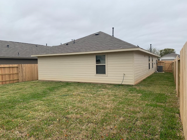 318 Riverwood Village Ln, Sealy, TX 77474 - rear view of house with cooling unit and a shingled roof