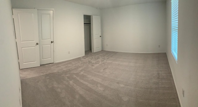 318 Riverwood Village Ln, Sealy, TX 77474 - unfurnished bedroom with carpet flooring, baseboards, and a closet