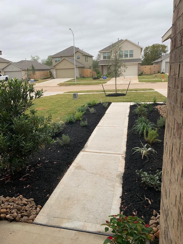 318 Riverwood Village Ln, Sealy, TX 77474 - view of green lawn with a residential view