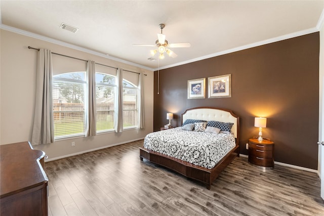 4610 Countrymeadows Dr, Spring, TX 77388 - bedroom featuring ornamental molding, wood finished floors, baseboards, and a ceiling fan