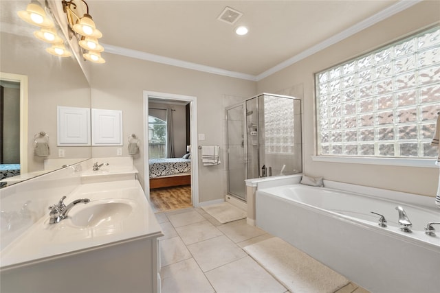 4610 Countrymeadows Dr, Spring, TX 77388 - ensuite bathroom with a garden tub, a stall shower, double vanity, ornamental molding, and tile patterned floors