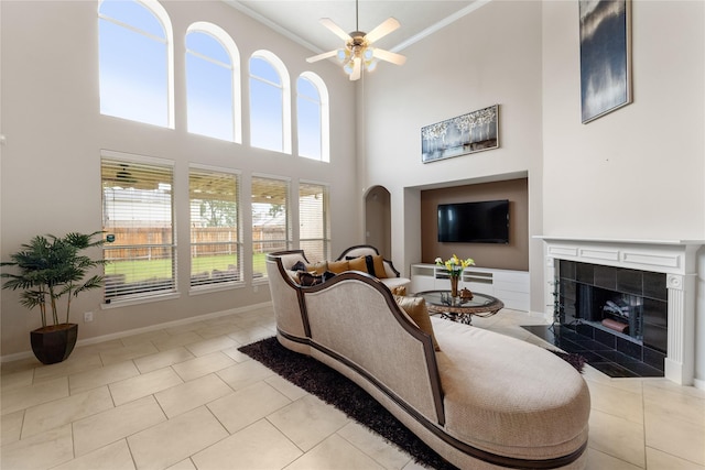 4610 Countrymeadows Dr, Spring, TX 77388 - living room with ceiling fan, ornamental molding, healthy amount of natural light, a tile fireplace, and baseboards