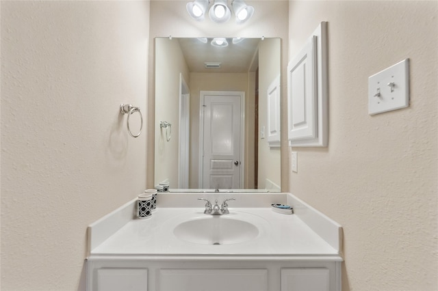4610 Countrymeadows Dr, Spring, TX 77388 - bathroom featuring vanity and a textured wall