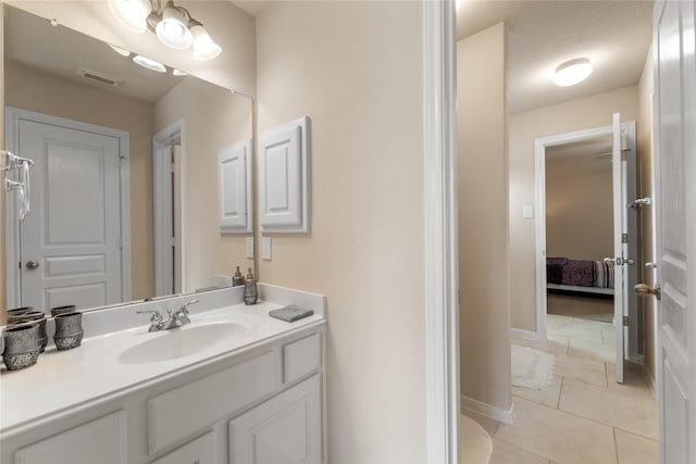 4610 Countrymeadows Dr, Spring, TX 77388 - ensuite bathroom with vanity, tile patterned flooring, and baseboards