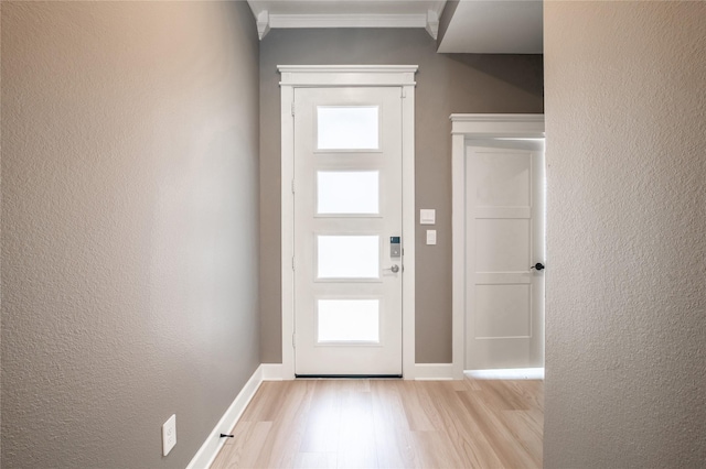 14424 Tunnel Tree Ct, Conroe, TX 77384 - foyer entrance featuring wood finished floors, ornamental molding, baseboards, and a textured wall