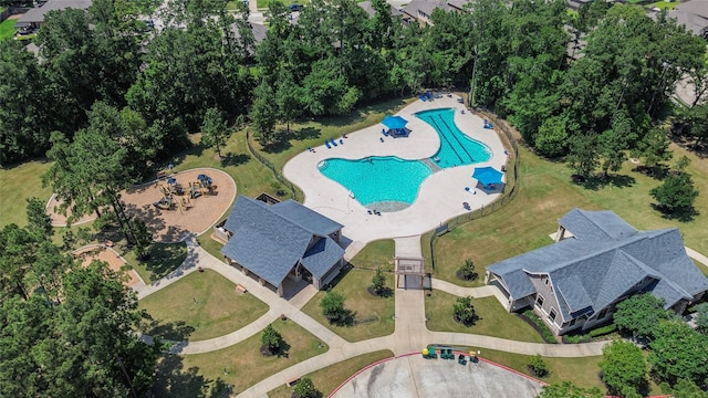 14424 Tunnel Tree Ct, Conroe, TX 77384 - aerial view of property and surrounding area with a pool
