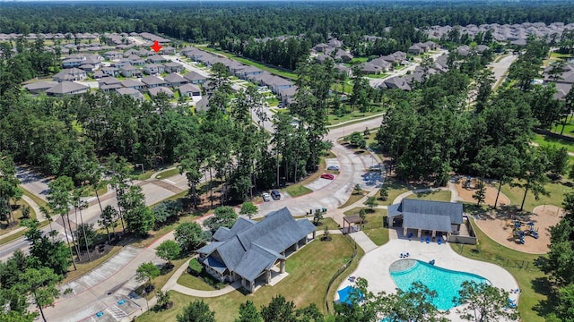 14424 Tunnel Tree Ct, Conroe, TX 77384 - aerial view of property and surrounding area featuring nearby suburban area, a forest, and a pool area