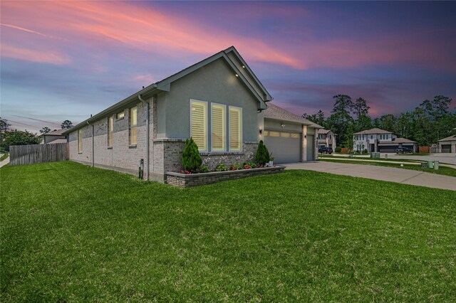 14424 Tunnel Tree Ct, Conroe, TX 77384 - single story home with driveway, an attached garage, stucco siding, and brick siding