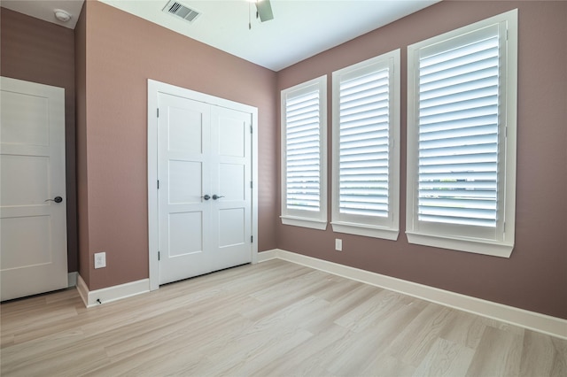 14424 Tunnel Tree Ct, Conroe, TX 77384 - unfurnished bedroom with light wood finished floors, baseboards, and a ceiling fan