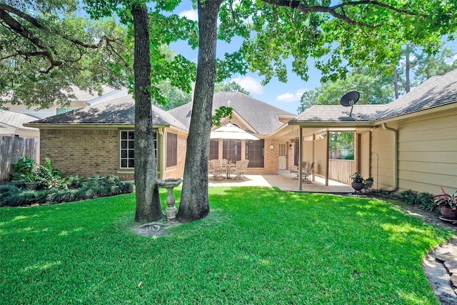 2718 Alderleaf Pl, Spring, TX 77388 - rear view of house featuring brick siding, a patio area, and roof with shingles
