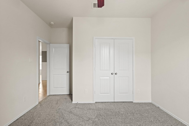 14021 Buffalo Gap Trl, Conroe, TX 77384 - unfurnished bedroom featuring carpet floors, a closet, and baseboards