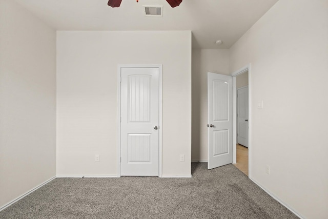 14021 Buffalo Gap Trl, Conroe, TX 77384 - unfurnished bedroom with carpet, baseboards, and a ceiling fan