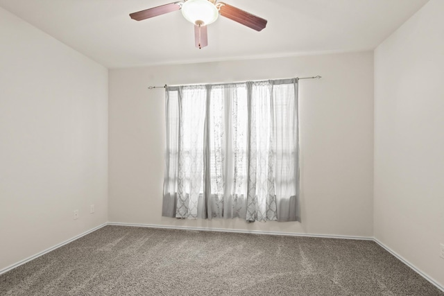 14021 Buffalo Gap Trl, Conroe, TX 77384 - spare room with carpet, a ceiling fan, and baseboards