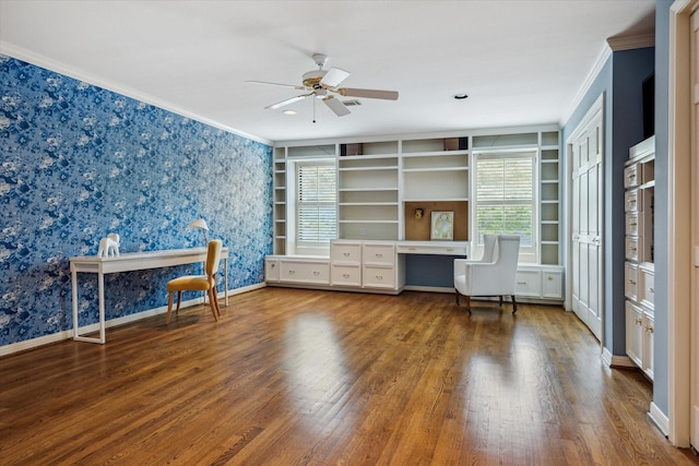 2628 Glen Haven Blvd, Houston, TX 77025 - unfurnished office featuring wood finished floors, ornamental molding, ceiling fan, wallpapered walls, and built in desk