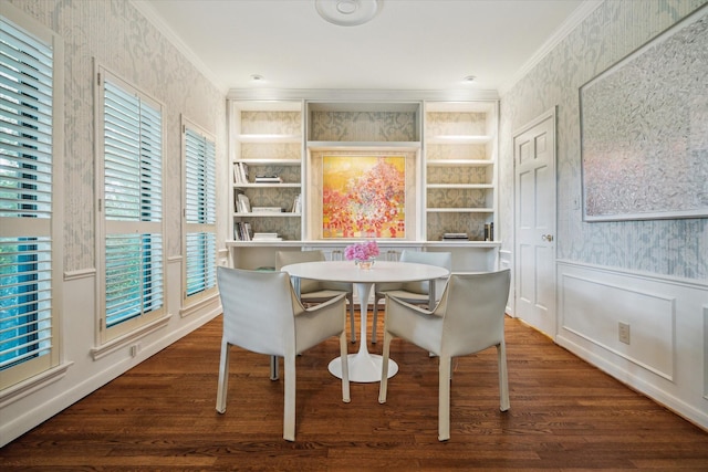 2628 Glen Haven Blvd, Houston, TX 77025 - dining space featuring ornamental molding, wallpapered walls, wood finished floors, built in shelves, and wainscoting