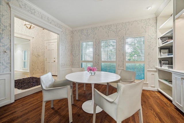 2628 Glen Haven Blvd, Houston, TX 77025 - dining room featuring ornamental molding, dark wood-type flooring, a wainscoted wall, a decorative wall, and wallpapered walls