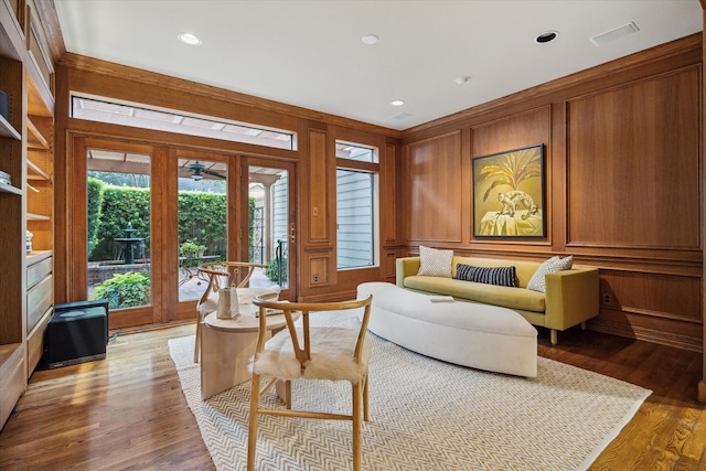 2628 Glen Haven Blvd, Houston, TX 77025 - living area with a ceiling fan, light wood finished floors, wooden walls, and recessed lighting