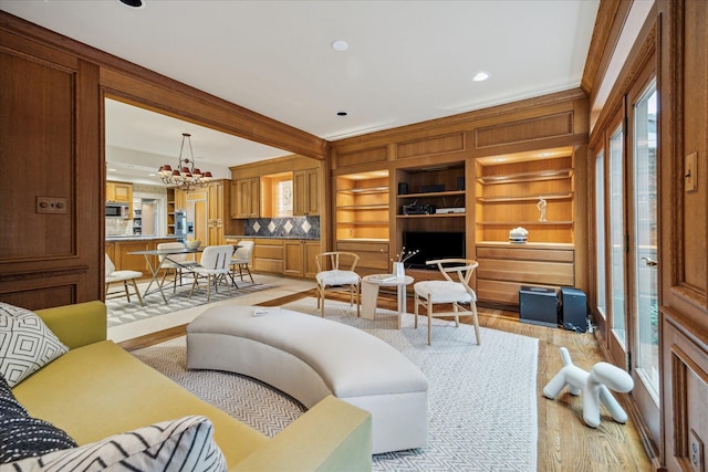 2628 Glen Haven Blvd, Houston, TX 77025 - living room featuring light wood finished floors, a chandelier, and recessed lighting