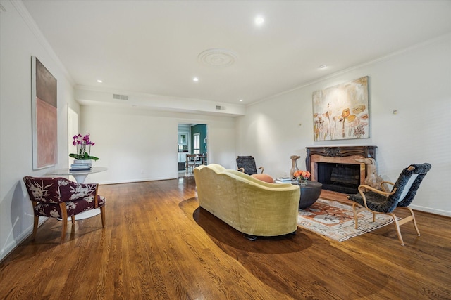 2628 Glen Haven Blvd, Houston, TX 77025 - living area with crown molding, wood finished floors, a premium fireplace, and recessed lighting