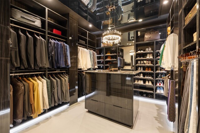 4521 San Felipe St Unit 1201, Houston, TX 77027 - walk in closet featuring a chandelier