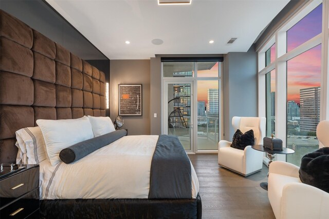 4521 San Felipe St Unit 1201, Houston, TX 77027 - bedroom with access to outside, wood finished floors, expansive windows, and recessed lighting