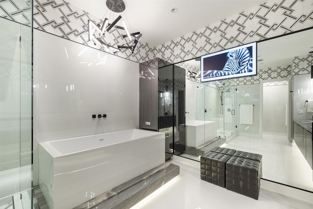 4521 San Felipe St Unit 1201, Houston, TX 77027 - bathroom with a bath, tile walls, and a stall shower