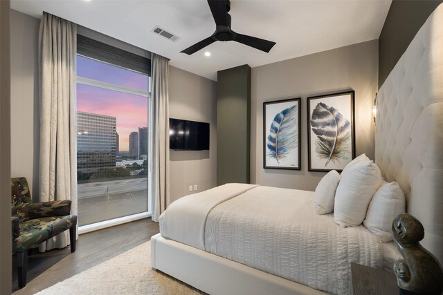 4521 San Felipe St Unit 1201, Houston, TX 77027 - bedroom featuring wood finished floors, recessed lighting, ceiling fan, and access to outside