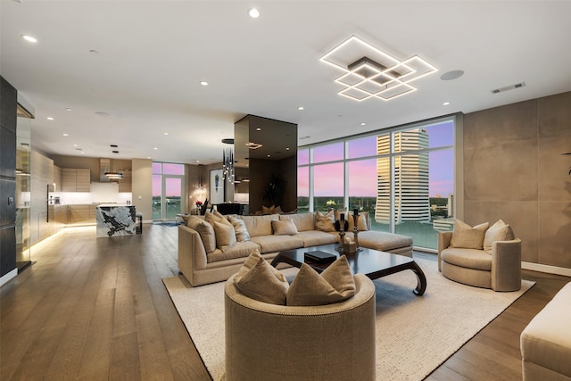 4521 San Felipe St Unit 1201, Houston, TX 77027 - living room featuring wood finished floors, recessed lighting, and a wall of windows