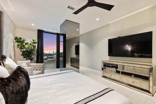 4521 San Felipe St Unit 1201, Houston, TX 77027 - bedroom with carpet floors, baseboards, recessed lighting, floor to ceiling windows, and ceiling fan