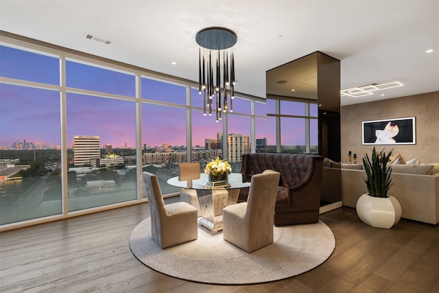 4521 San Felipe St Unit 1201, Houston, TX 77027 - dining area with wood finished floors, a skyline view, floor to ceiling windows, and a chandelier