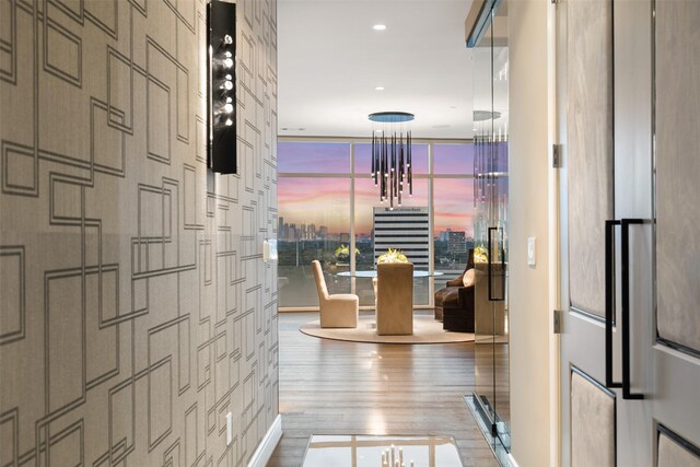 4521 San Felipe St Unit 1201, Houston, TX 77027 - hall with wood finished floors, a chandelier, and recessed lighting