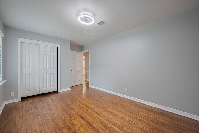 2218 Silverbonnet St, Houston, TX 77055 - unfurnished bedroom with wood finished floors and a closet