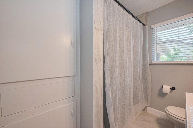 2218 Silverbonnet St, Houston, TX 77055 - full bathroom with marble look tile flooring and a shower with curtain