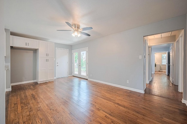 2218 Silverbonnet St, Houston, TX 77055 - unfurnished living room with a ceiling fan, wood-type flooring, and attic access
