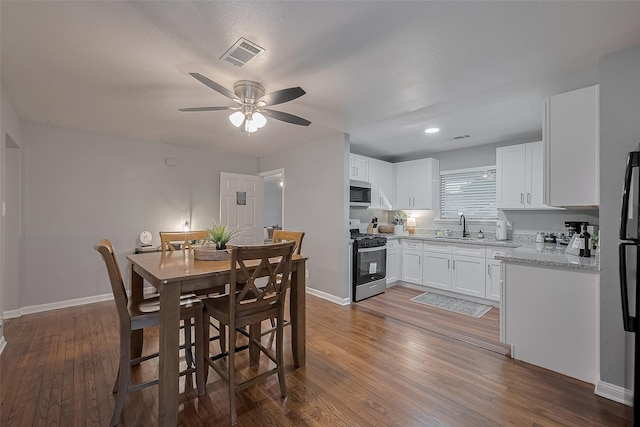 2218 Silverbonnet St, Houston, TX 77055 - dining space featuring a ceiling fan and dark wood-style floors